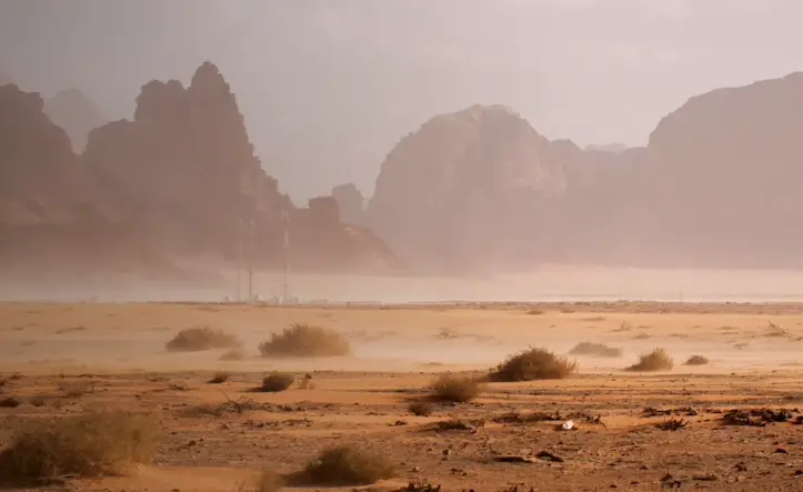 Dust storm over the desert landscape of Wadi Rum in Jordan.